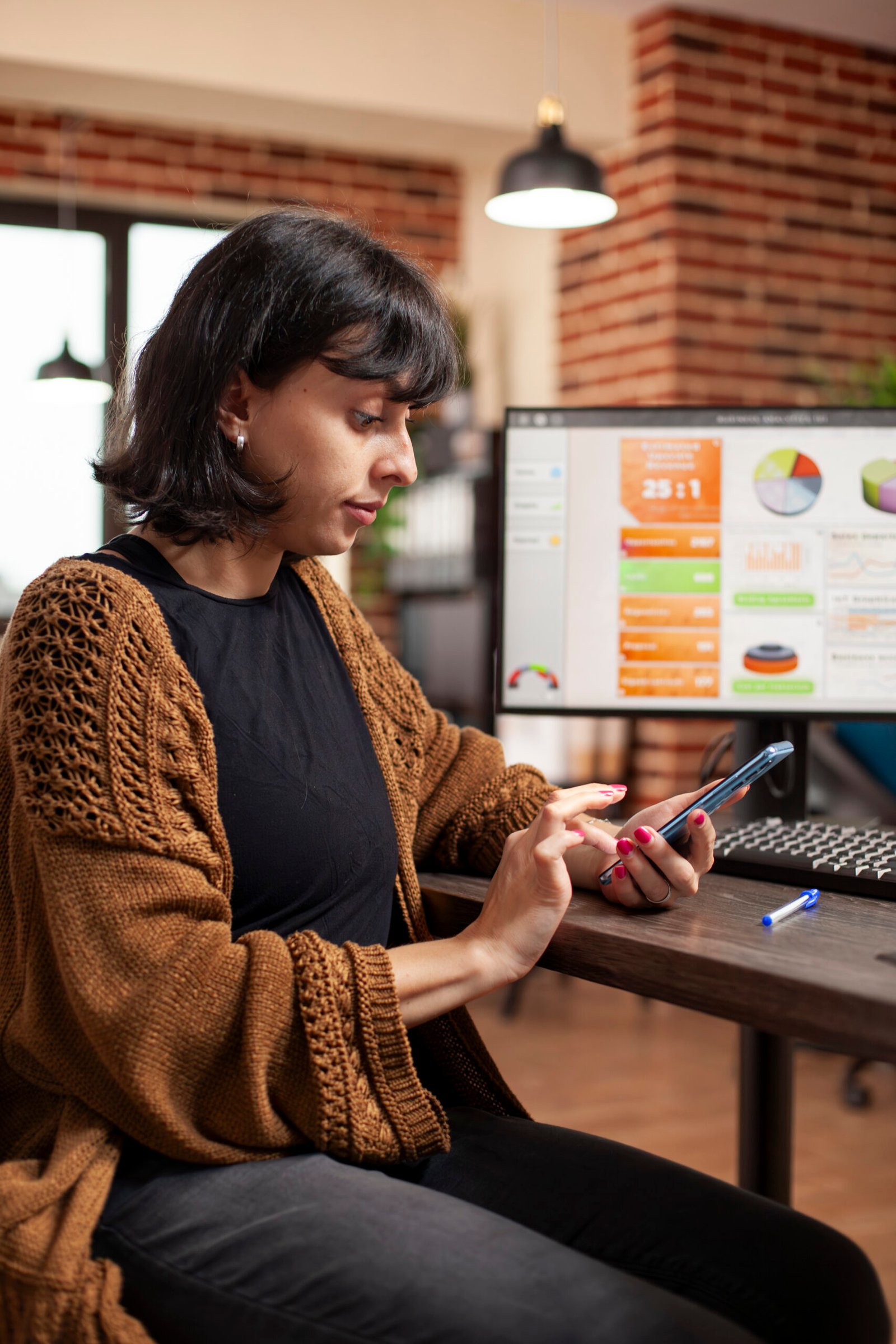Employee checking emails on mobile phone advertising